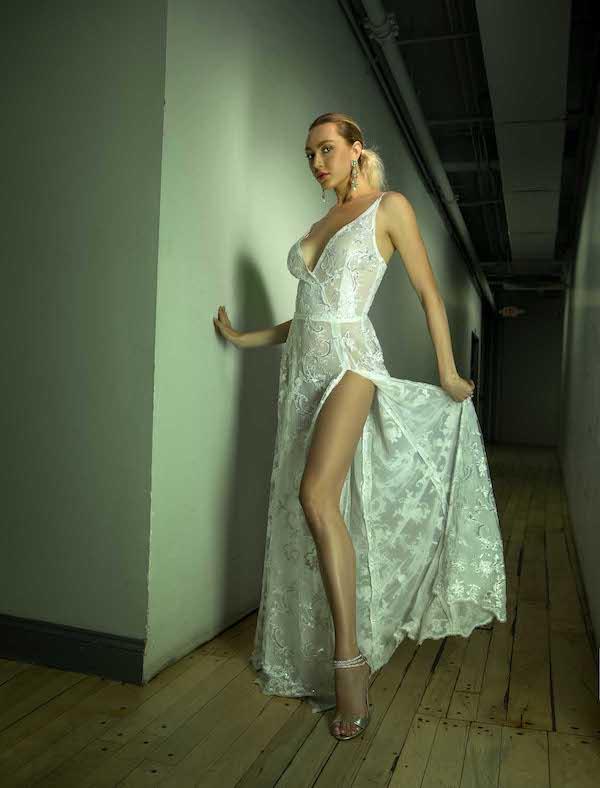 Caucasian female model in handmade white embroidered gown photographed by Marty Gottlieb
